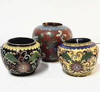Three small enameled metal cloisonné vases with intricate decorative floral enamel work in multiple colors, showing full set and details.
