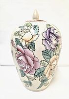 Front view of the vintage Chinese ginger jar showing floral pattern on cream base.