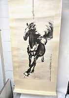 Full front view of galloping horse scroll, showing overall design and mounting