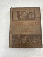 Front cover of the 1918 Fourth Reader California textbook showing detailed embossed illustrations and title
