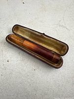 Amber straight cigarette holder inside fitted case