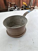 Copper pot viewed from the top angle showing the pot's interior and shape.