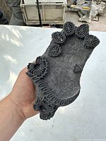 Front view of the hand carved wooden printing block showing floral pattern and detailed carving.