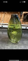 Green hand blown Bianconi glass vase upright showing bubble center design and overall shape.