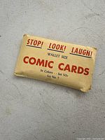 Front view of the sealed pack showing the brand and description: 'STOP! LOOK! LAUGH! WALLET SIZE COMIC CARDS In Colors Set 50c Set No. 7'