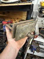 Left side view of the Globemaster Speedmaster bench vise showing the handle and jaws holding the vise.