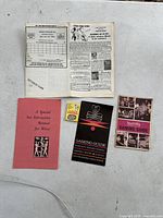 Image showing all items together on a light surface, highlighting the vintage booklets and coupon booklet.