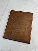 Top view of the rectangular white oak wooden display plaque showing smooth polished wood grain and medium brown finish.