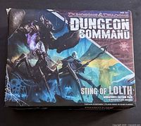 Front of the Dungeon Command: Sting of Lolth box with artwork of fantasy characters and spider imagery, showing box condition and item branding.