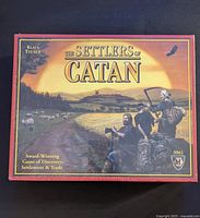 Front face of The Settlers of Catan box, shrink wrapped, showing artwork and title