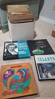 Five vinyl records including Beethoven, Chopin, Iolanthe opera, Romantic Moods and a white box with assorted classical records.