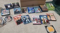 Photo of DVD and CD cases arranged on floor, titles visible include The Office, Boston Legal, Fox TV Drama, Love Actually among others.