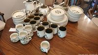 Overview of entire Denby Shamrock set on table