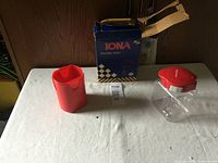 Vintage Iona portable mixer in red and white, red measuring cup, original blue box with checkered design