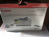 Box of Canon PIXMA TR4522 printer showing model and features such as wireless, print, copy, scan, fax, and ADF.
