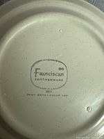 Bottom of a Franciscan Earthenware stoneware piece showing brand mark and origin details.