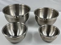 All four heavy aluminum mixing bowls in various sizes displayed from front angle.