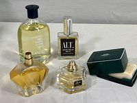 Overview of all five items: Canoe Original Eau de Toilette, Alt Agar Gold No.2 perfume, two other fragrance bottles (Gucci and Zaharoff), and Hermes soap in plastic box.