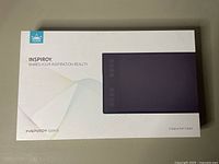 Box of Huion Inspiroy Q11Kv2 Creative Pen Tablet, showing product branding and an image of the tablet on front.