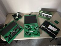 Overview of all precision measuring tools laid out on table