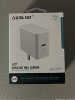 Front of sealed box showing LBT Ultra Fast 30W PD wall charger image and branding, highlighting 30W fast charging capability and USB-C port.
