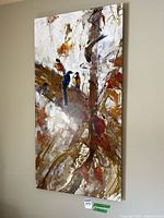 Vertical canvas print depicting multiple birds on branches in an impressionistic painting style with predominantly brown, white, and orange tones.