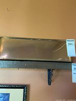 Top-down angled view showing the rectangular shape of the copper pot and its reflective surface with wear.