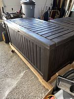 Front and top angled view of deck box on pallet
