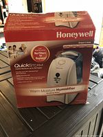 Original Honeywell box showing front with product image and QuickSteam technology features
