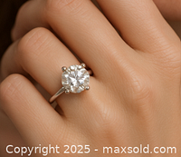 Ring worn on finger showing fit, band profile and diamond appearance against skin