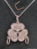 Close-up front view of the three-linked heart silver pendant inscribed with 'BEST FRIENDS' on an 18-inch silver chain necklace.