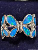 Close-up of the butterfly silver ring with blue opalite stones on wings, shown from the top side.