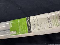 Photo of style selections adjustable closet rod label showing dimensions and product details.