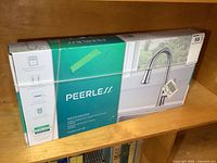 Peerless Westchester kitchen faucet box showing brand and product name.