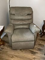 Front-facing view of the power lift chair showing full upholstery and seat profile