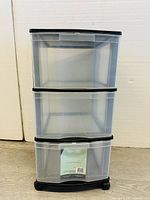 Front view of the 3 unit plastic storage drawer organizer showing clear drawers and black top frame