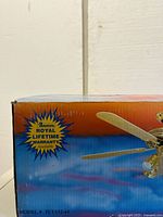 Close-up of the side of the box showing model number FLT552-45 and 'Royal Lifetime Warranty' claim by Sanvil.