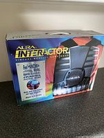Aura Interactor game wear box showing vest and branding