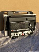 Front-right angle view of GAF 3000 S Super 8 movie projector showing controls and handle