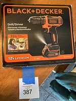 Black+Decker cordless drill/driver box showing 12V lithium-ion battery, LED light, and 35% more compact size labeling.