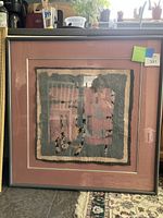 Framed mixed media art piece in 34x34 inches size, predominantly pink and grey with textured layers and abstract forms in equestrian theme.