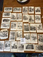 Top-down photo of 30 vintage black and white postcards laid out on table. Each postcard shows a detailed architectural sketch by Elizabeth ONeill Verner featuring various southern buildings and street scenes.