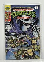 Front cover of Teenage Mutant Ninja Turtles Adventures #1 comic, showing the whole comic in protective sleeve.