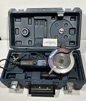 Mastercraft Twin Cutter in its molded carrying case with blade guard and power cord visible