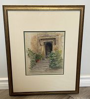Full view of framed watercolour painting showing stone staircase with potted plants and arched door.