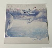 Front cover of the Rush 'Grace Under Pressure' album showing the surreal icy landscape and faceless humanoid figure artwork.
