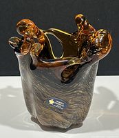 Front and side view of the amber Murano glass vase showing twisted organic rim and White Cristal label.