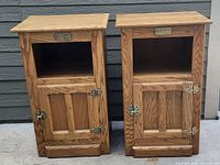Photo of the two vintage wooden side tables front side showing the open shelf and lower cabinet door with latch and hinges.