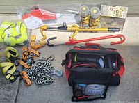 Full overview of automotive kit items laid out on concrete