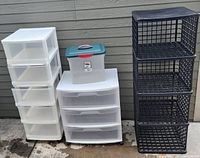 Overview of all plastic storage units and containers included in the lot.